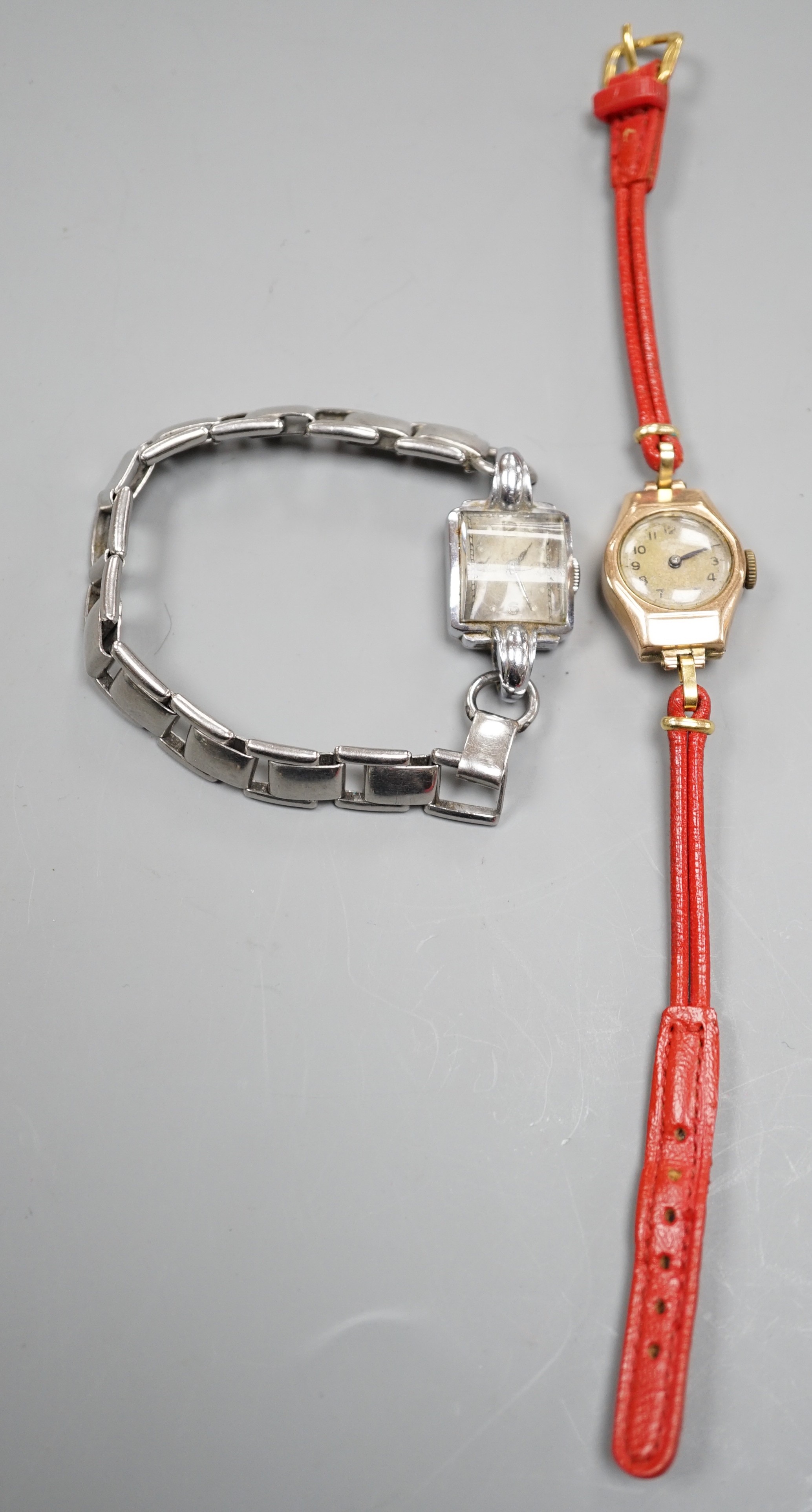 A lady's 9ct gold Rotary manual wind wrist watch, on a fabric strap, together with a lady's stainless steel manual wind wrist watch.